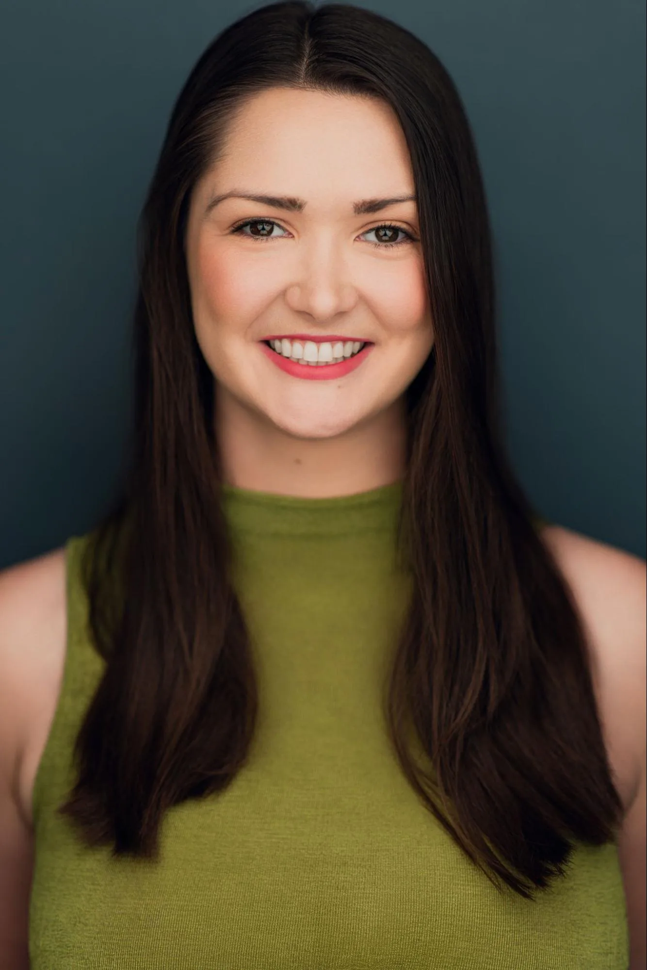 Veronica Murphy smiling in an olive green top